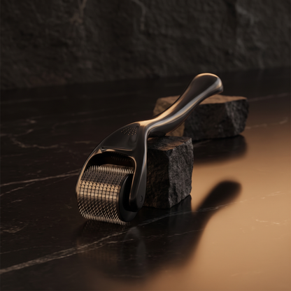 540 derma roller standing on a dark marble countertop