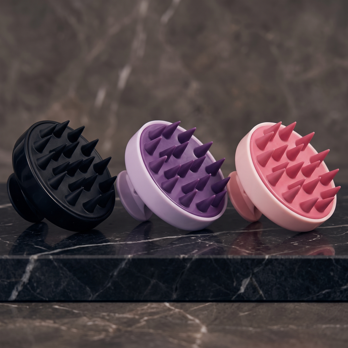 Scalp massager in black, purple and pink