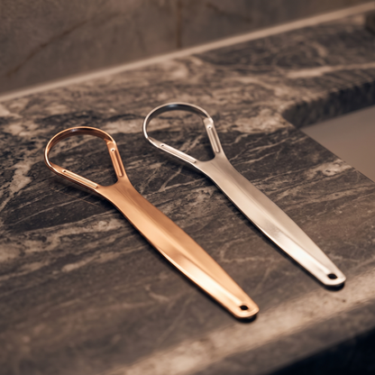 Tongue scraper in gold and silver