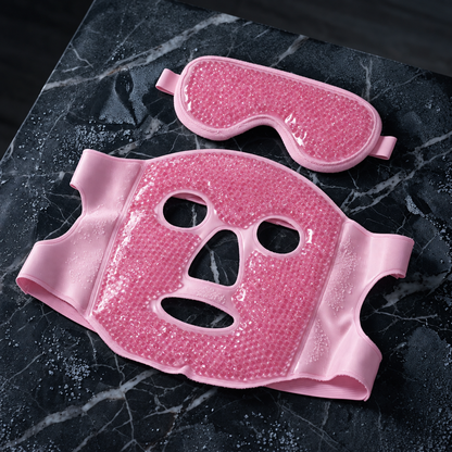 Pink hot and cold face mask and eye mask on dark marble